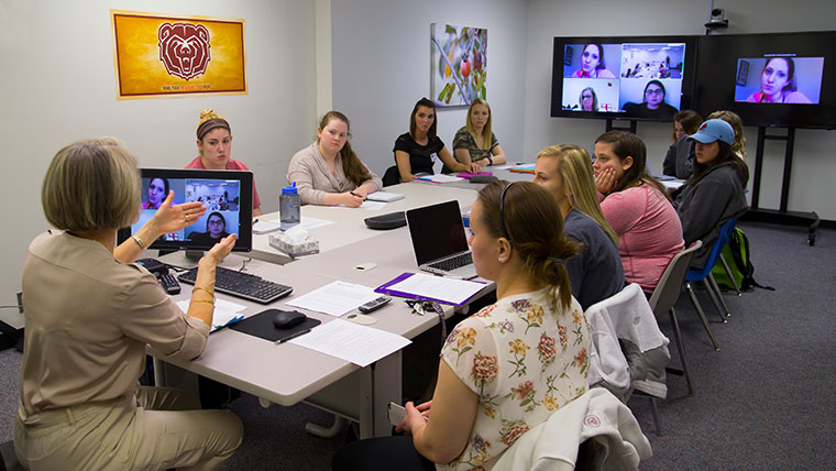 Missouri State faculty teaching a classroom of students using Zoom technology. 