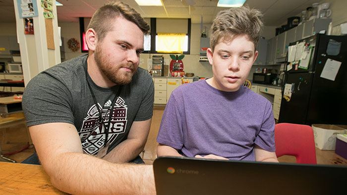Missouri State student helping middle school student