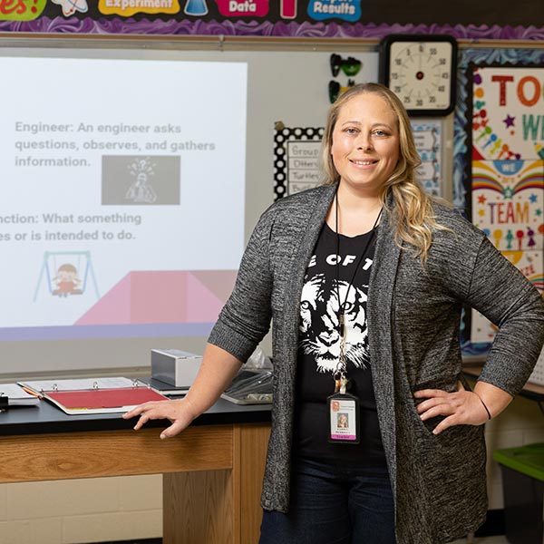 Educational technology program graduate Carrie Perrigue in a classroom.