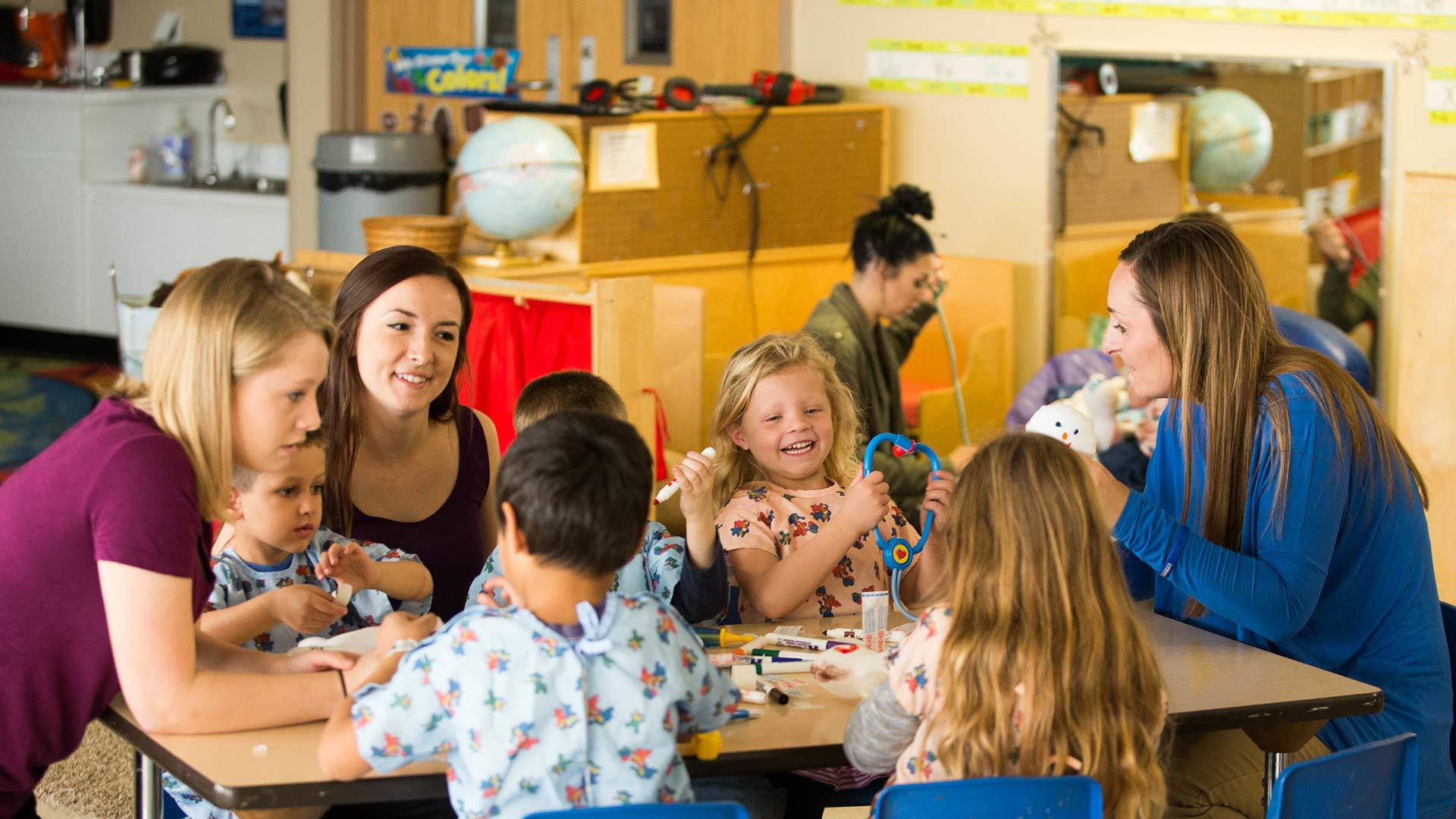 A teacher talks to students