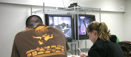 Students observing television screens