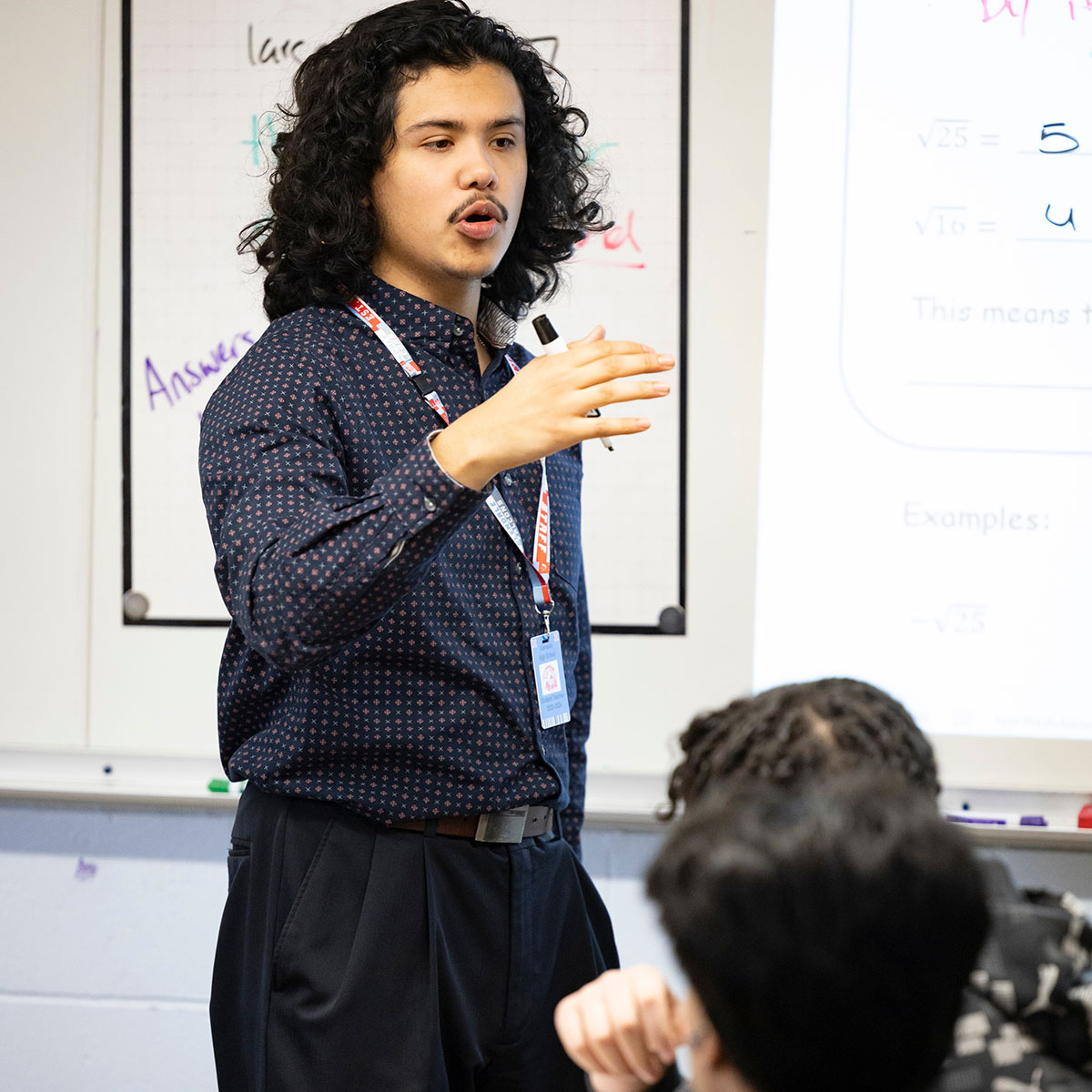 MSU student Joseeduardo Granados Rodriguez explains a math concept to a class of students at Glendale High School.