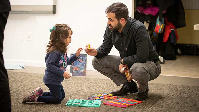 Teacher working one-on-one with elementary student. 