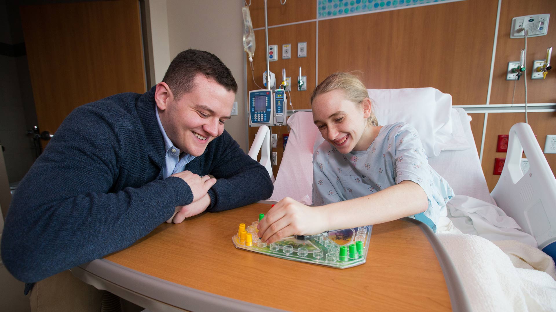 Child life student working with hospitalized kid