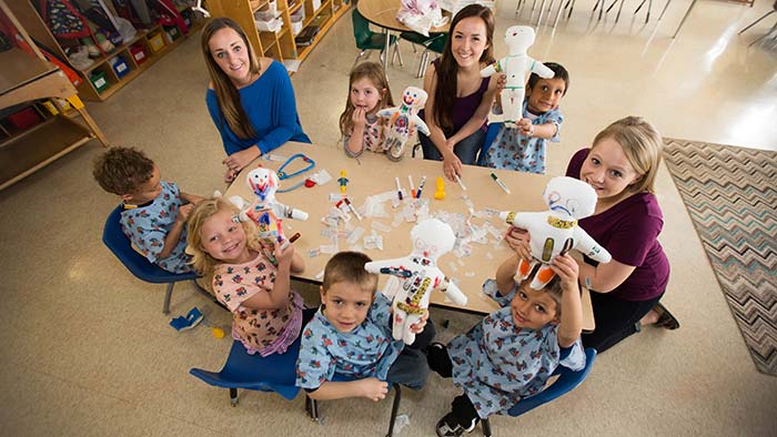 Child life majors doing art project with kids