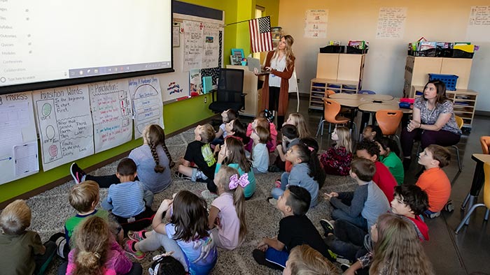 Alumnae Jessica Ridder and Laura Snelson teaching students at Sherwood Elementary