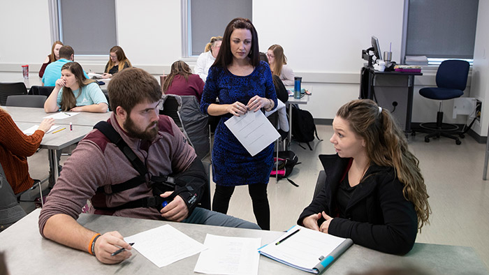 Education students doing classroom work