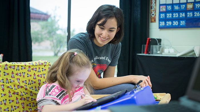 Teacher working with special needs student