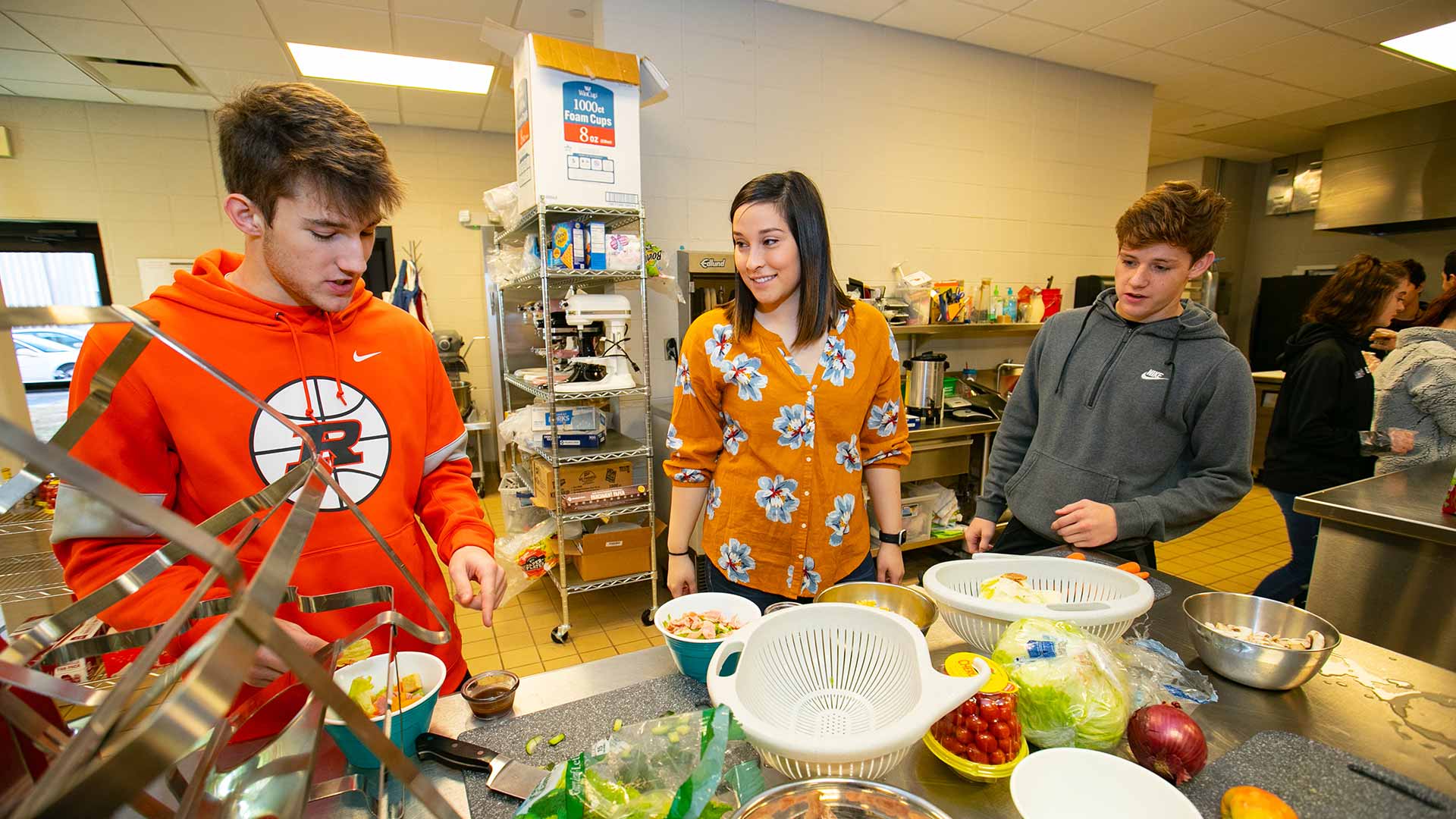 Student teacher instructing high school students