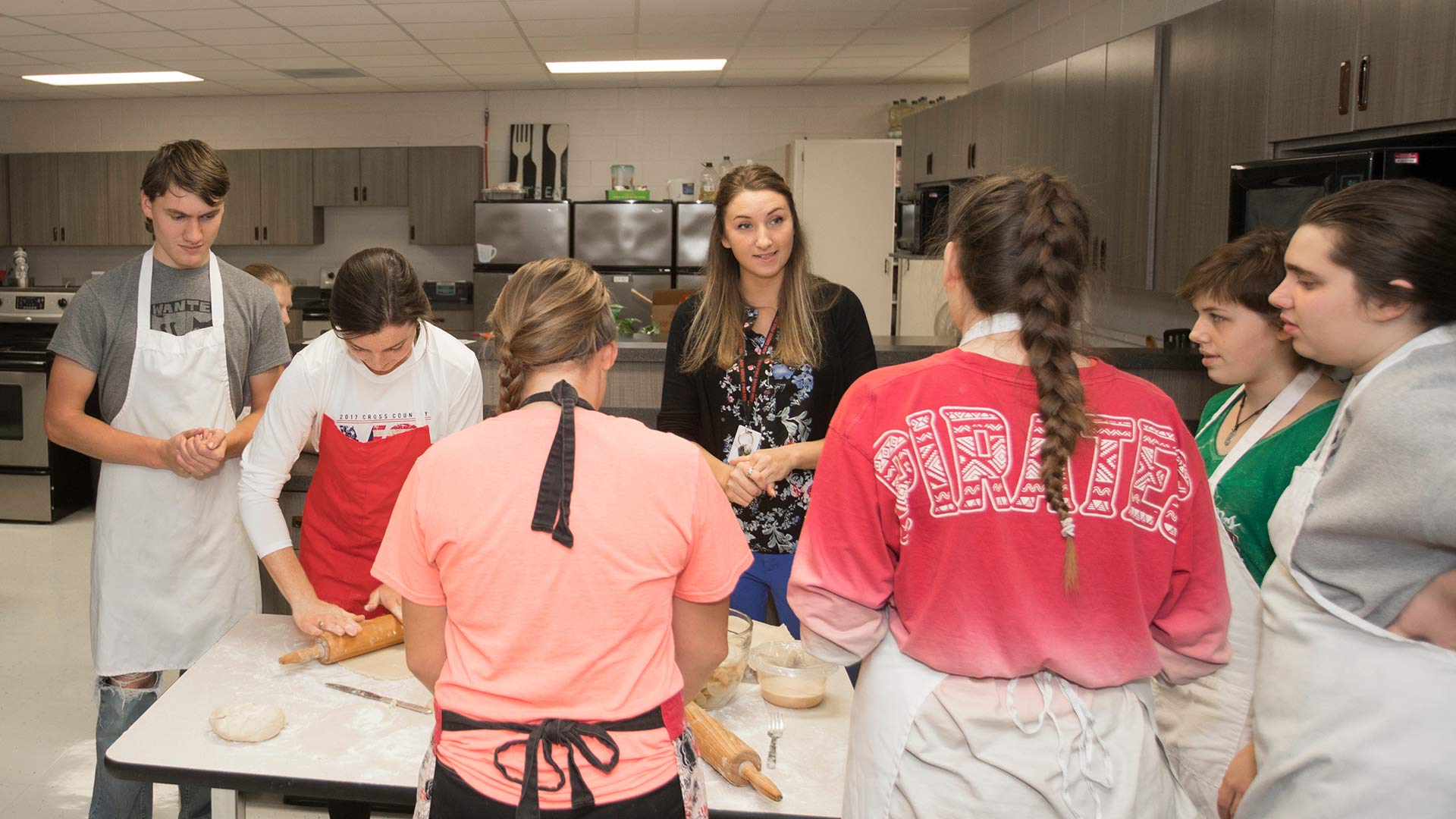 Family and consumer sciences teacher instructing high school students