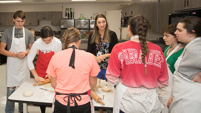 Family and consumer sciences teacher instructing high school students