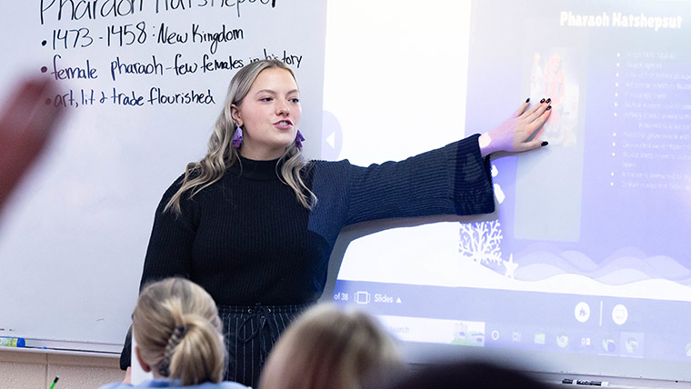 A middle school teacher gives a lesson on Egyptian history during class.