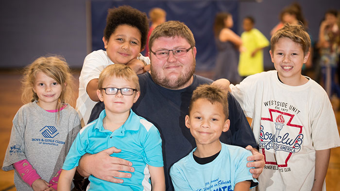 Boys and Girls club director with kids