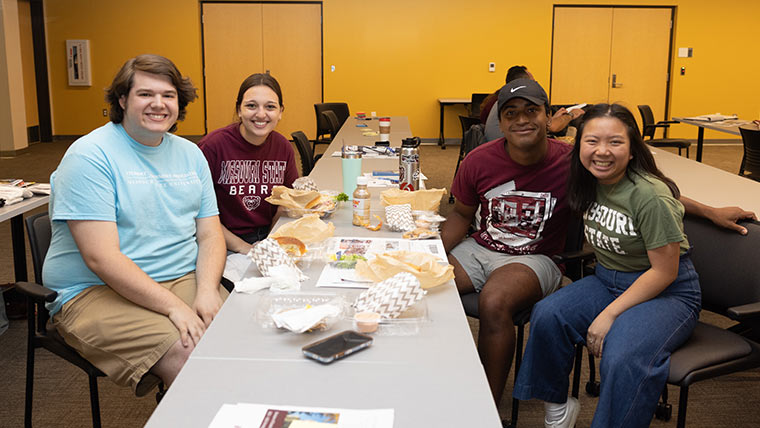 Student Affairs Leadership members having lunch during a retreat.